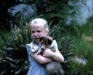 girl and puppy