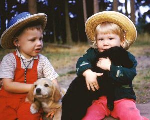 girland boy with dogs